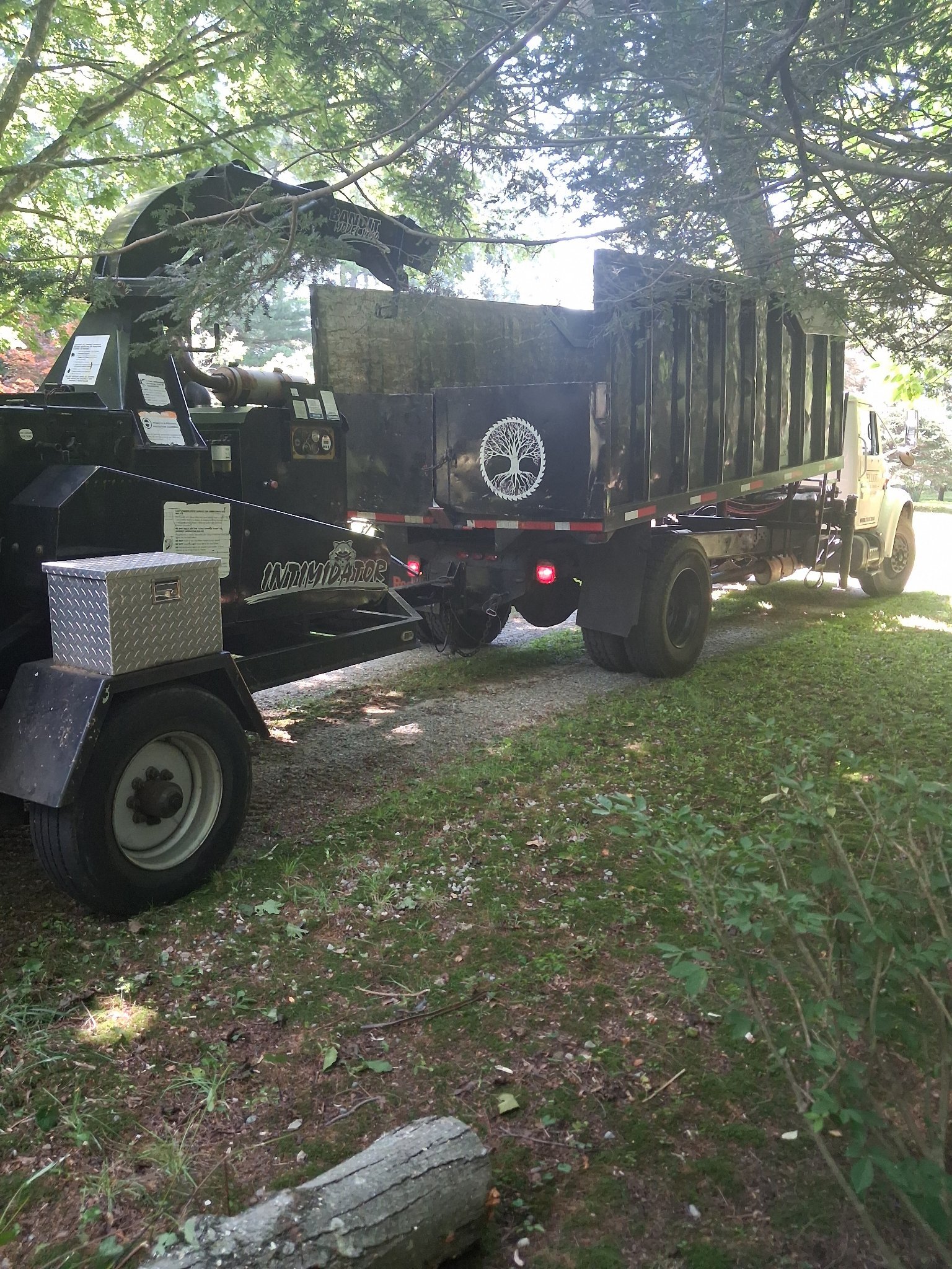 Elliott Tree Service 20-inch Bandit chipper and chip truck in Connecticut