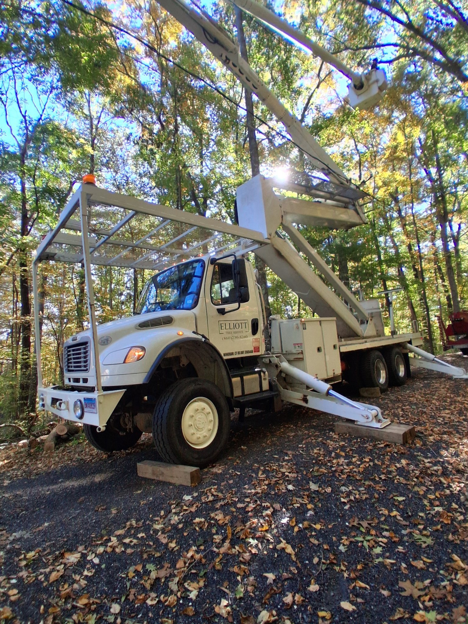 Elliott Tree Service bucket truck on a job in Connecticut